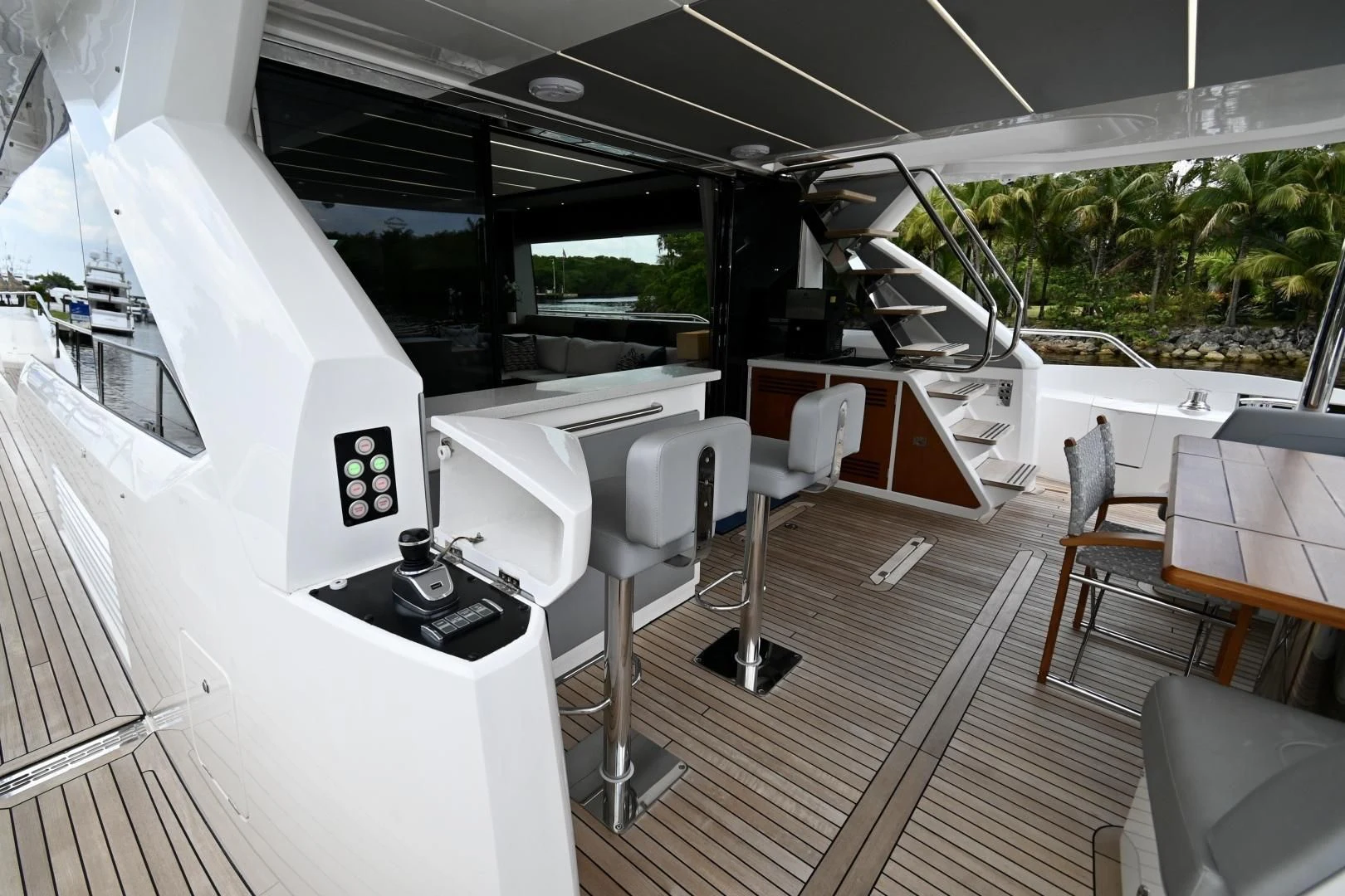 a boat with a deck and chairs aboard CAESURA Yacht for Sale