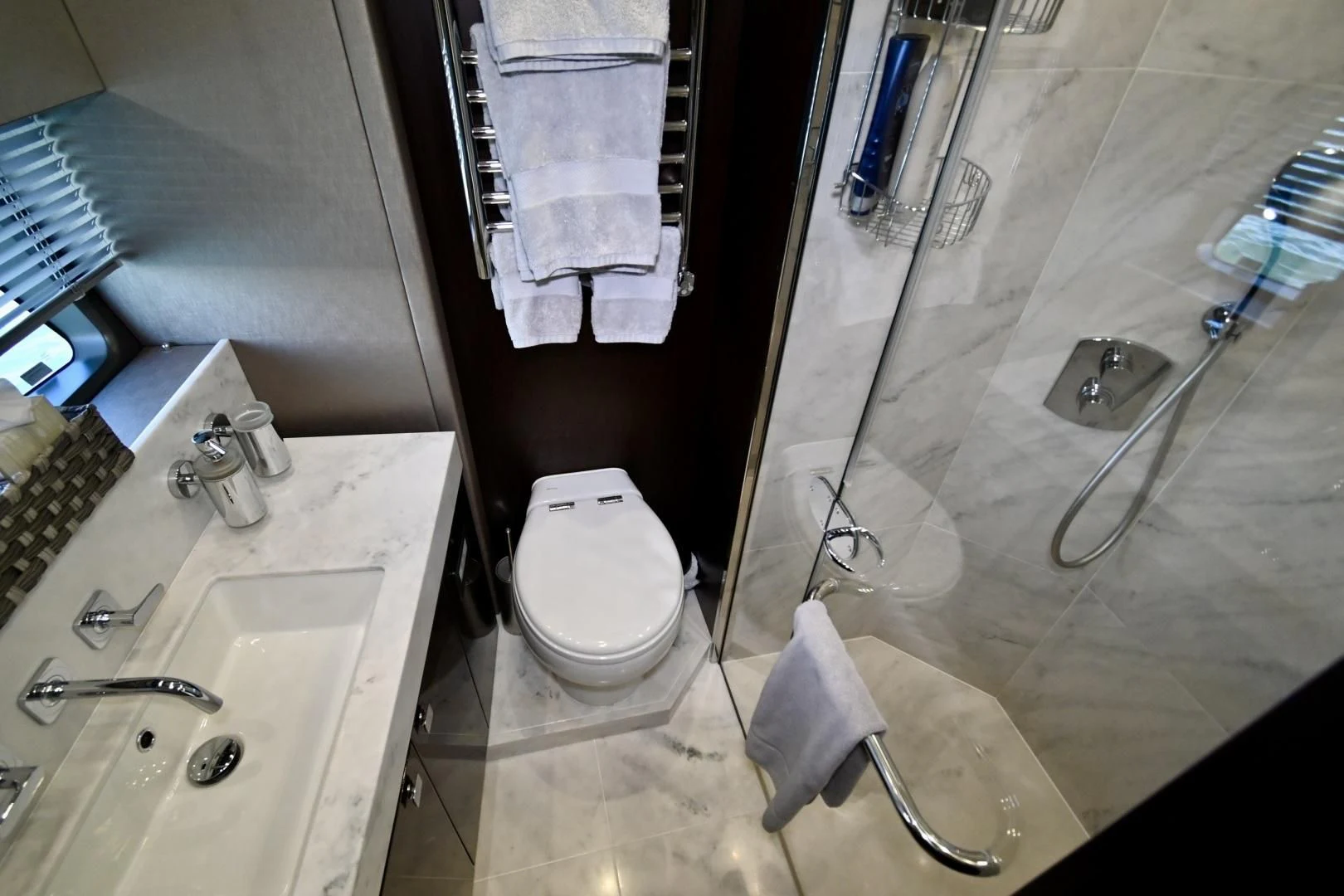 a bathroom with a shower and toilet aboard CAESURA Yacht for Sale