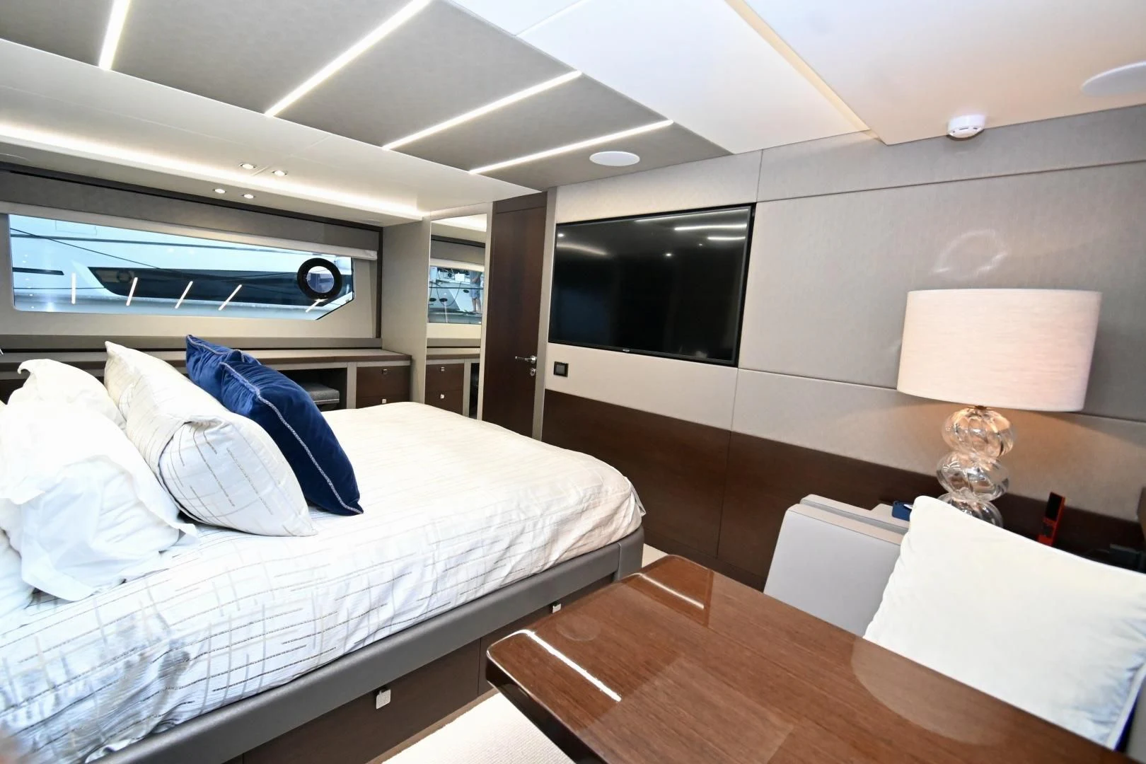 a room with a bed and a table aboard CAESURA Yacht for Sale