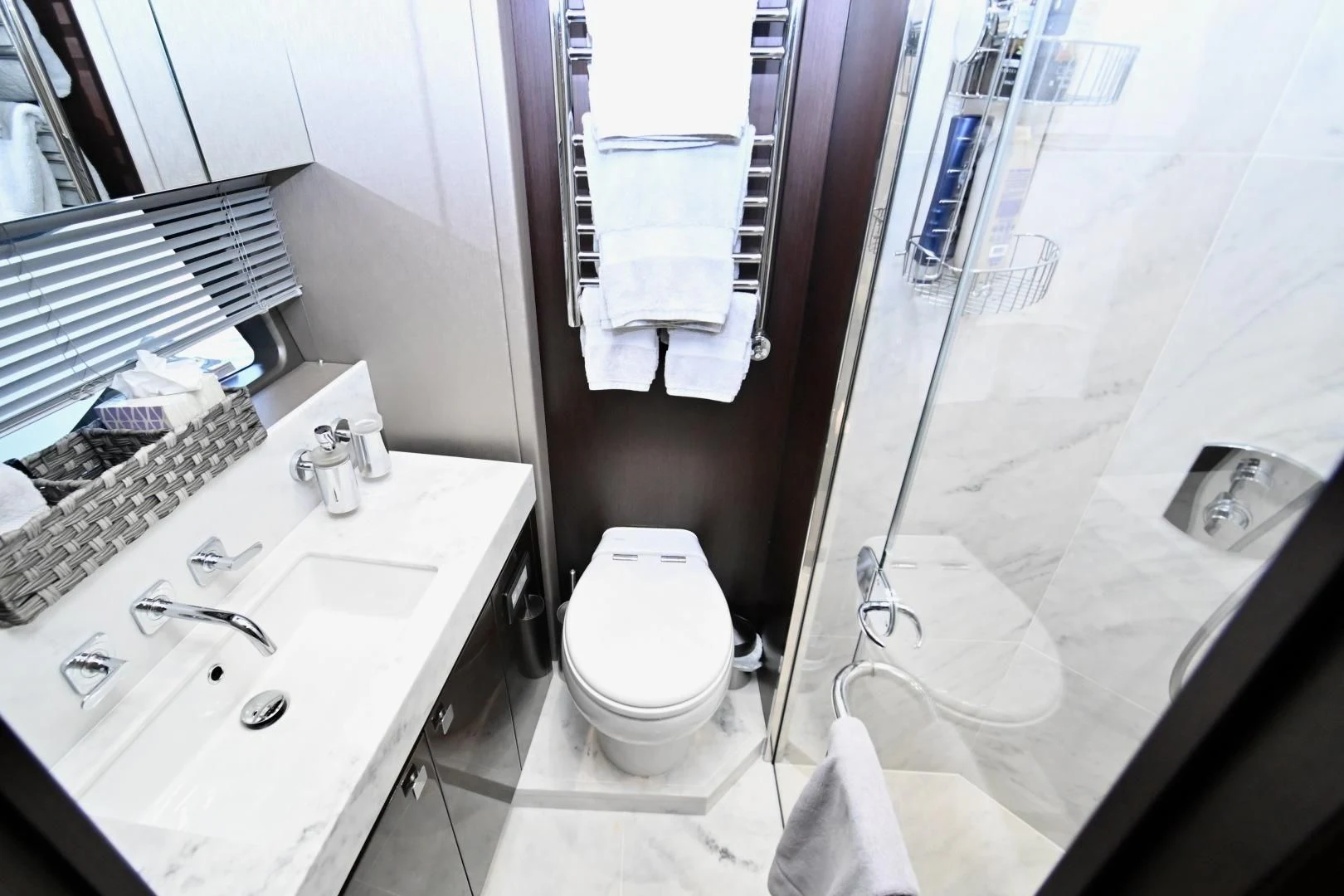 a bathroom with a sink toilet and bathtub aboard CAESURA Yacht for Sale