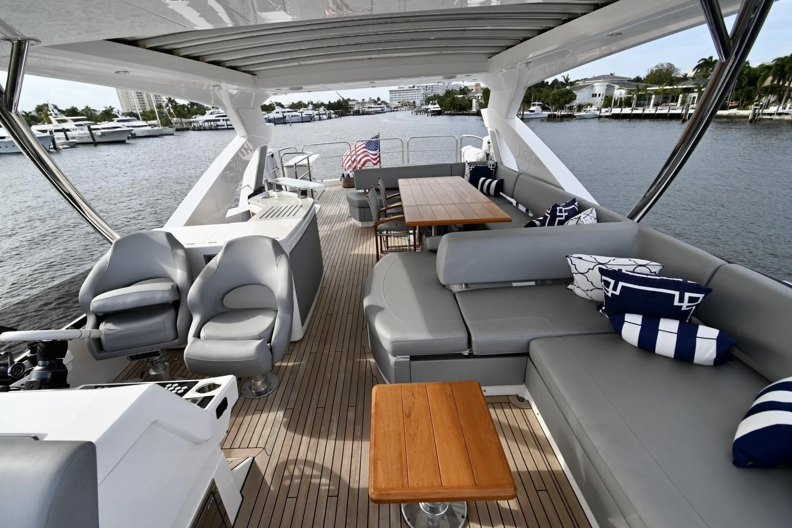 a boat with a deck and a deck with a flag on it aboard CAESURA Yacht for Sale