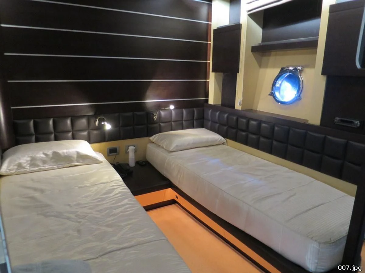 a room with two beds aboard AZIMUT 86S Yacht for Sale