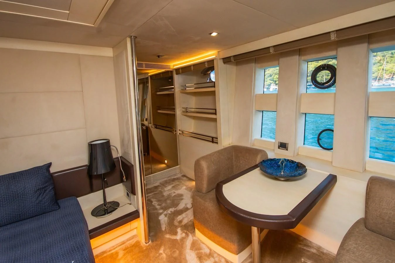 a living room with a table and chairs aboard AZIMUT 86S Yacht for Sale