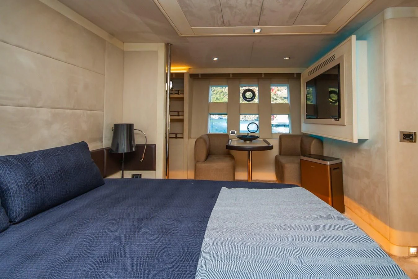 a bedroom with a bed and a desk aboard AZIMUT 86S Yacht for Sale