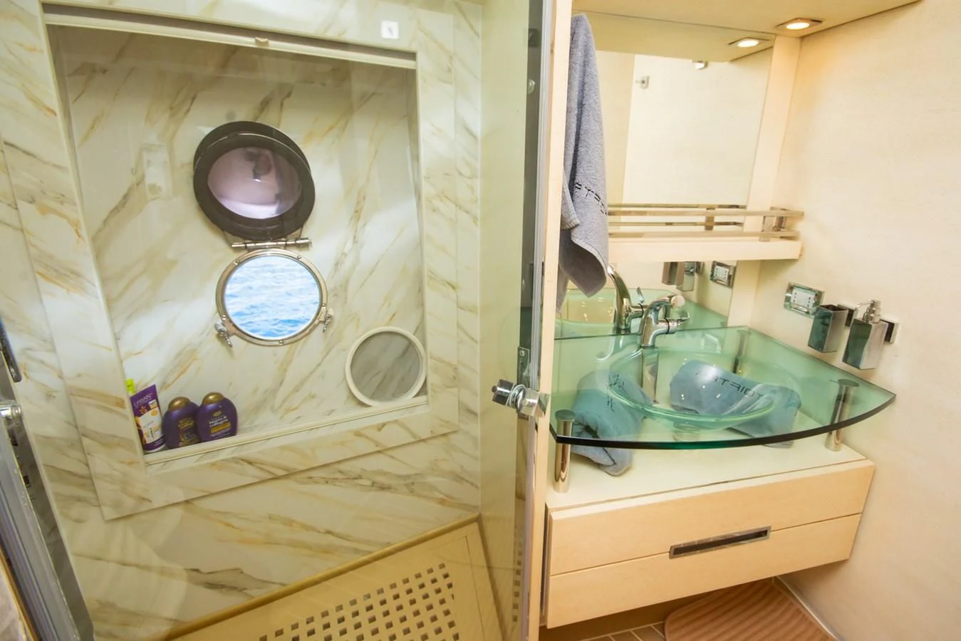 a bathroom with a sink and a mirror aboard AZIMUT 86S Yacht for Sale