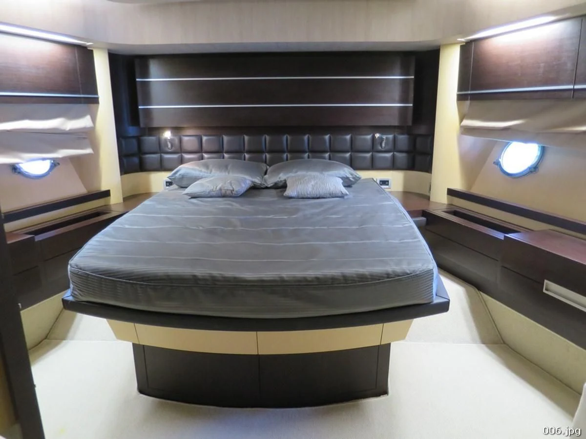 a bed in a room aboard AZIMUT 86S Yacht for Sale