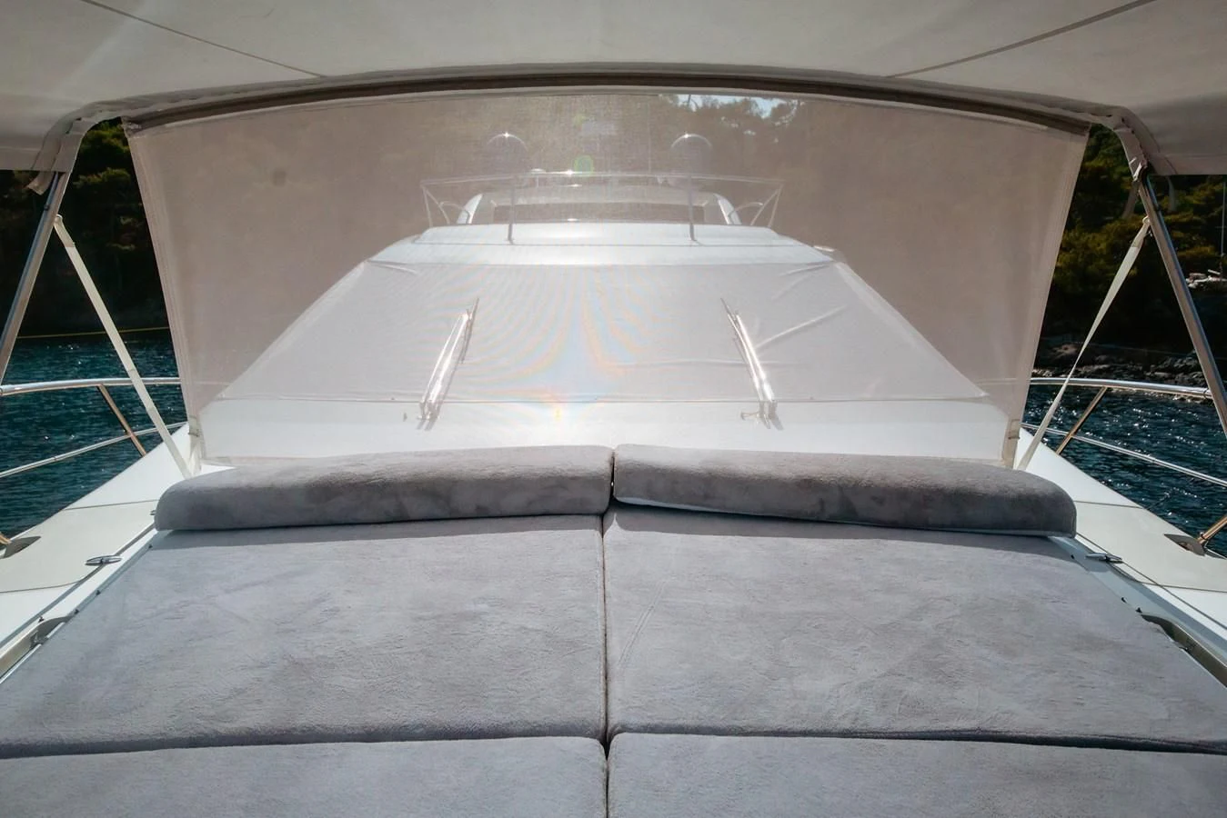 a white boat on a dock aboard AZIMUT 86S Yacht for Sale
