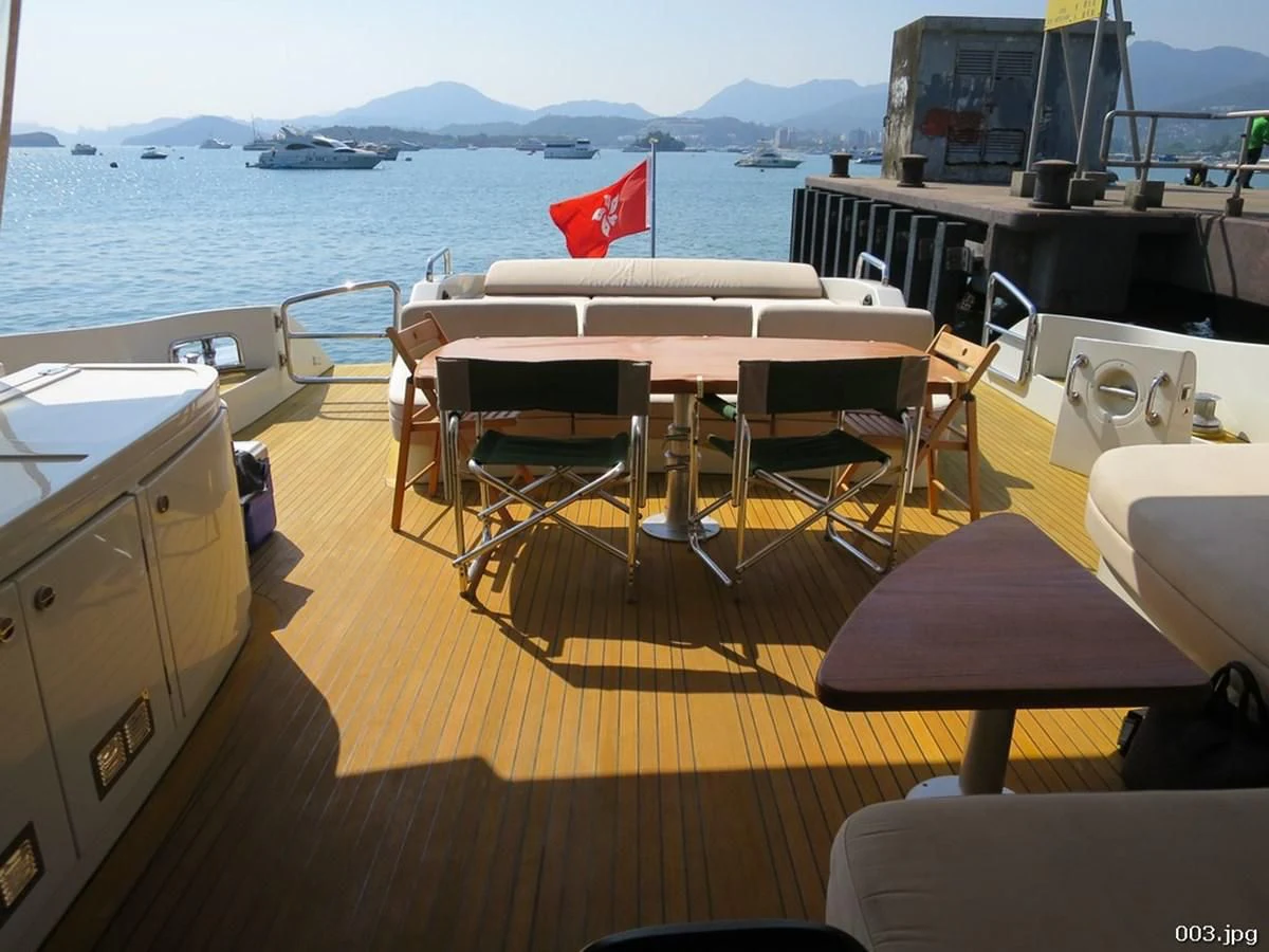 a room with tables and chairs aboard AZIMUT 86S Yacht for Sale