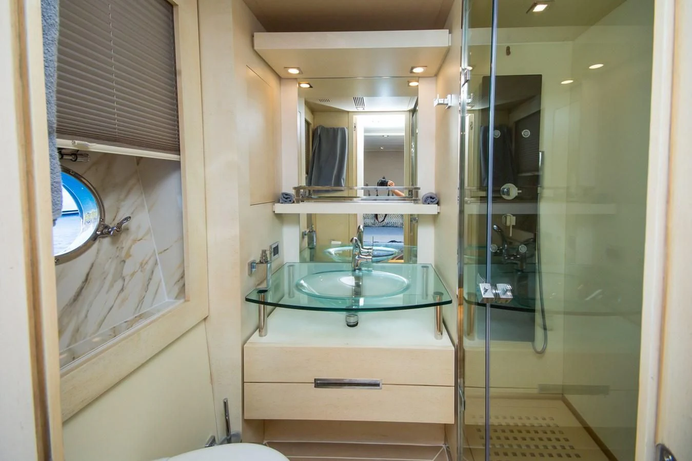 a bathroom with a sink and a mirror aboard AZIMUT 86S Yacht for Sale