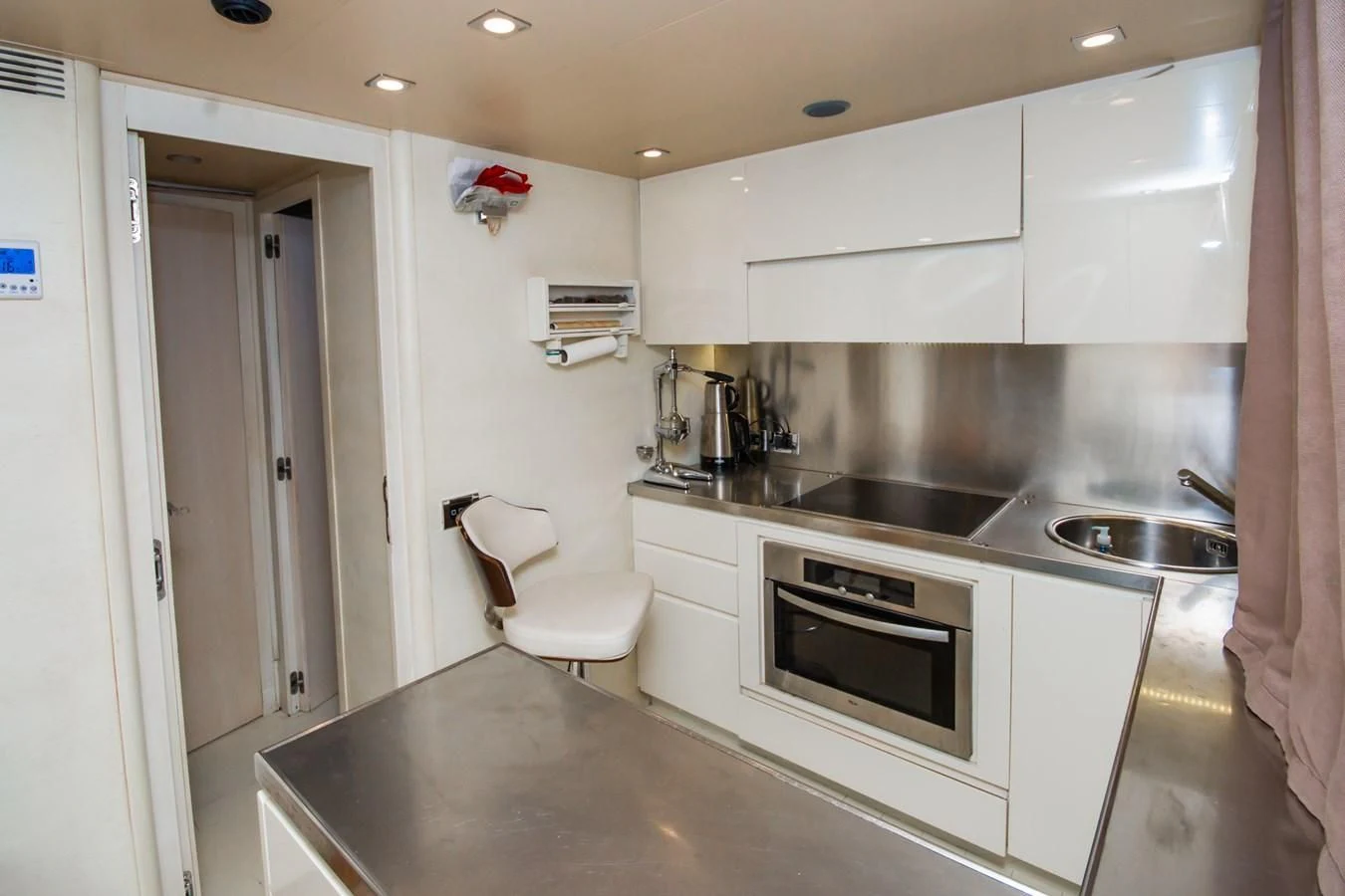 a kitchen with a sink and a microwave aboard AZIMUT 86S Yacht for Sale
