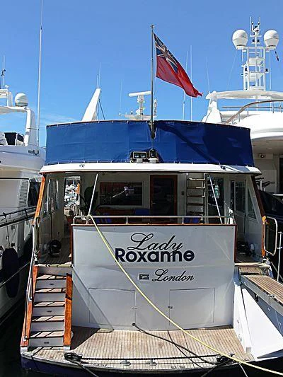 a boat with a flag on the front aboard MISS EVA Yacht for Sale