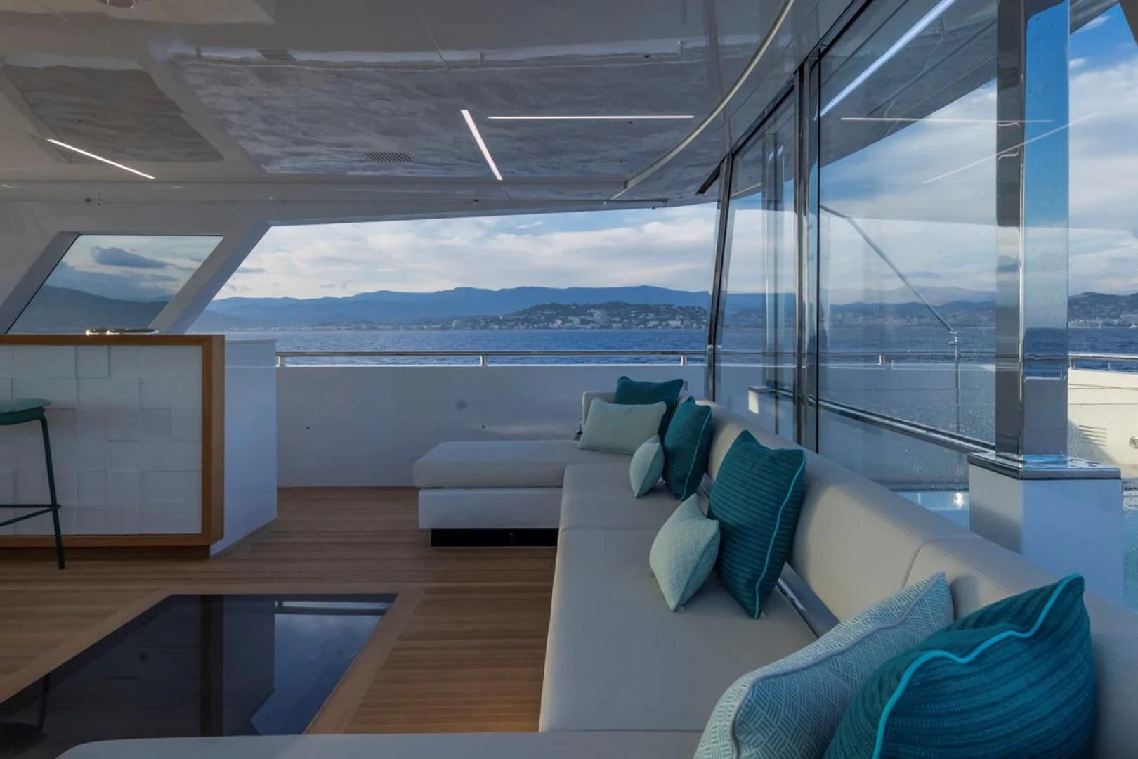 a room with a couch and a large window aboard 38M EXPLORER HULL 3 Yacht for Sale