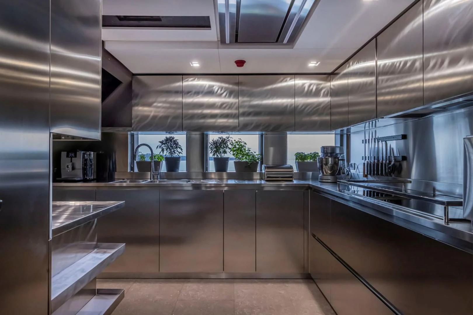 a kitchen with a large island aboard 38M EXPLORER HULL 3 Yacht for Sale