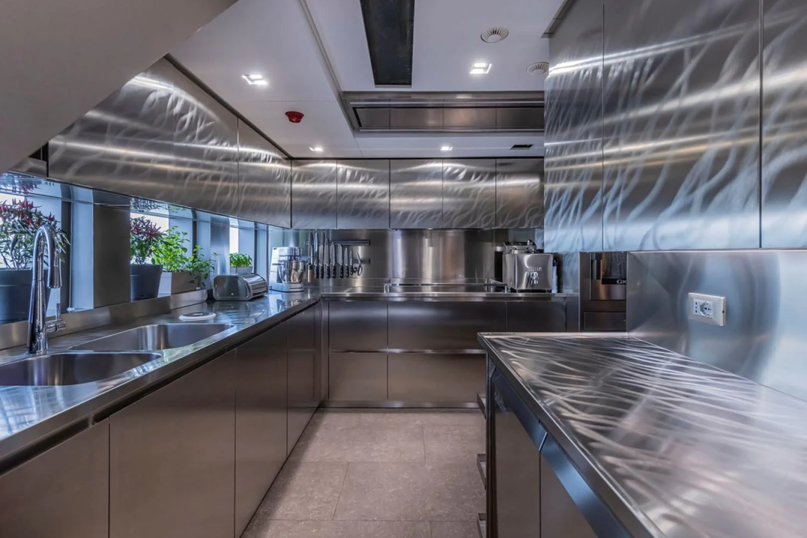 a kitchen with stainless steel appliances aboard 38M EXPLORER HULL 3 Yacht for Sale