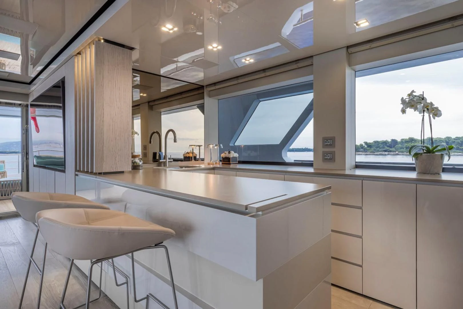 a kitchen with a large island aboard 38M EXPLORER HULL 3 Yacht for Sale