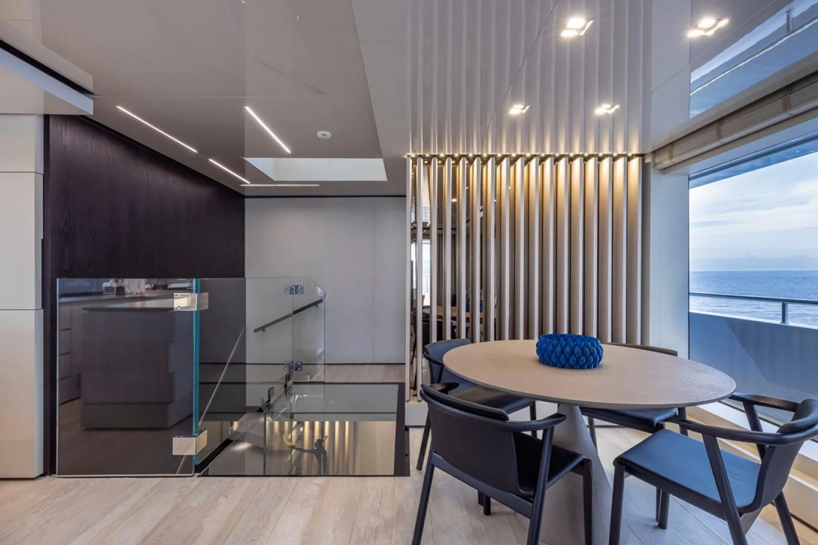 a kitchen with a table and chairs aboard 38M EXPLORER HULL 3 Yacht for Sale