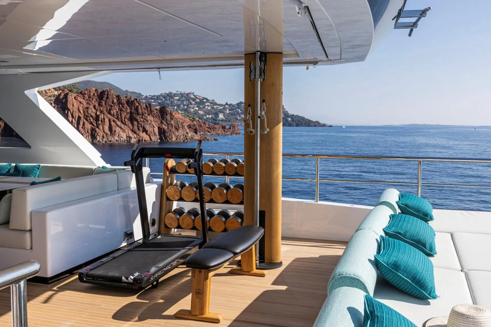 a deck with a laptop and a large body of water in the background aboard 38M EXPLORER HULL 3 Yacht for Sale