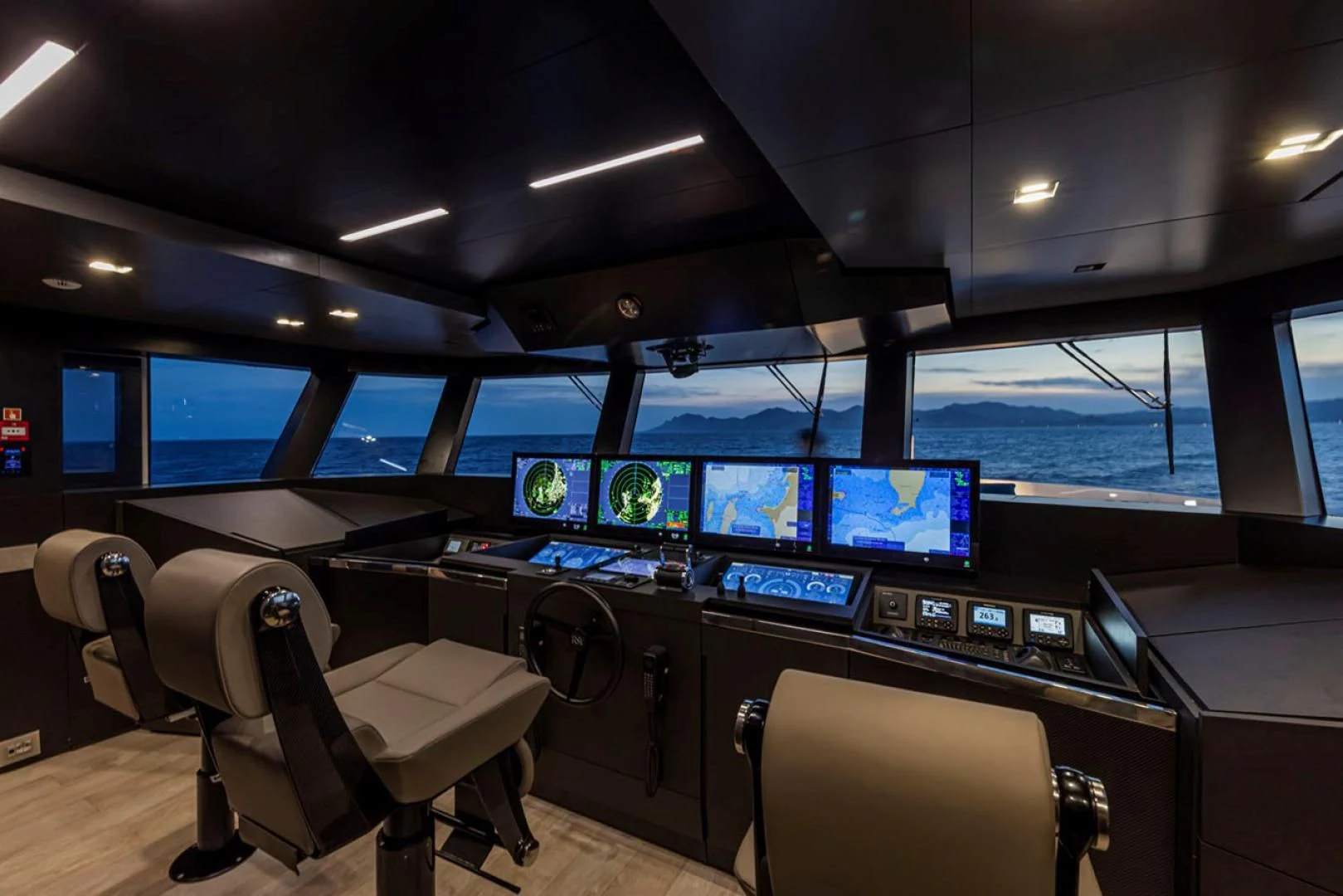 a room with many monitors and chairs aboard 38M EXPLORER HULL 3 Yacht for Sale