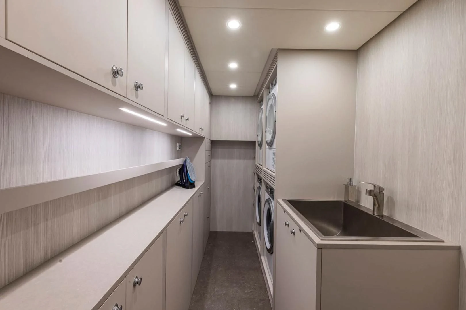 a kitchen with white cabinets aboard 38M EXPLORER HULL 3 Yacht for Sale
