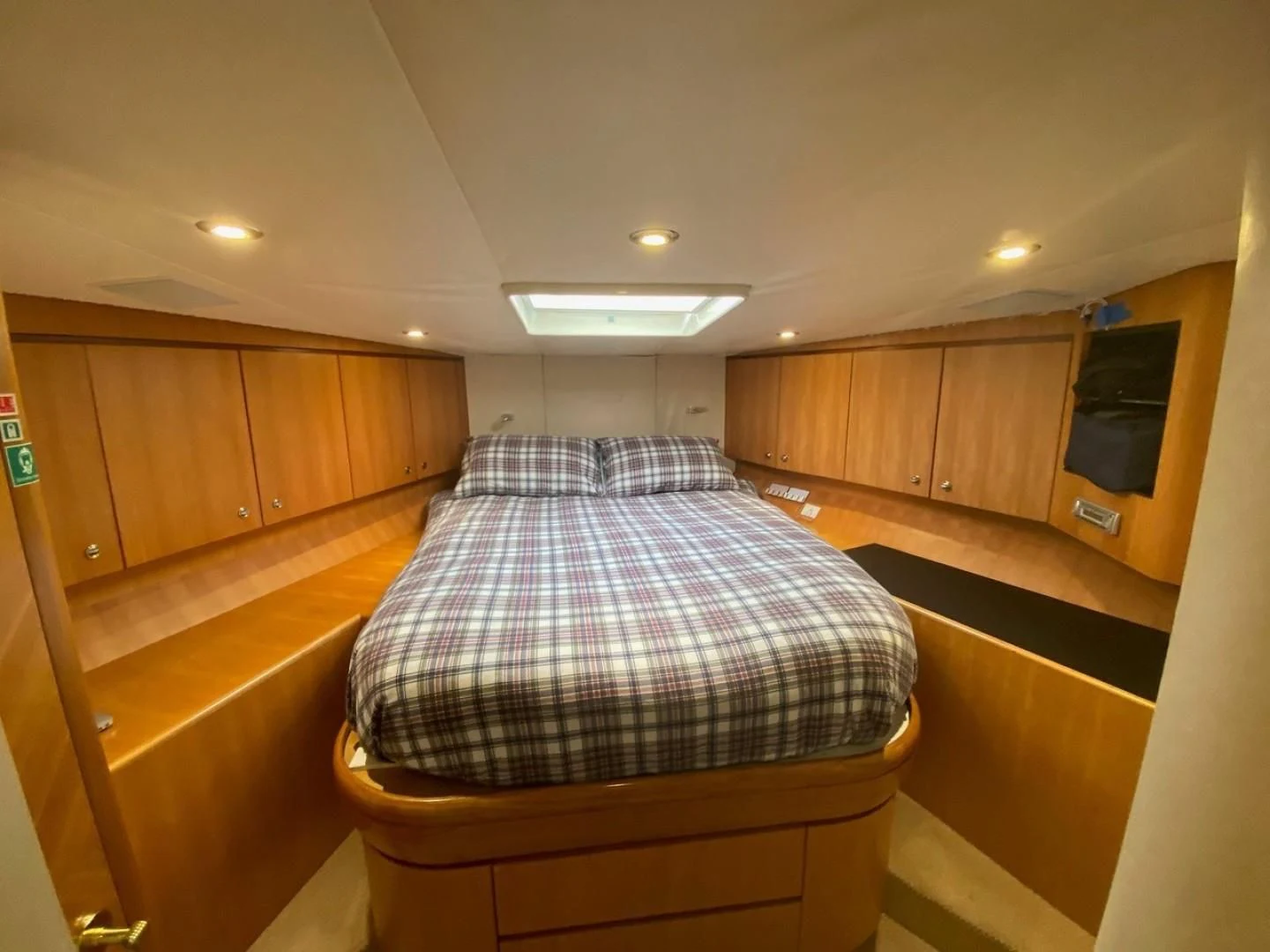 a bed in a room aboard EQUINOX X Yacht for Sale