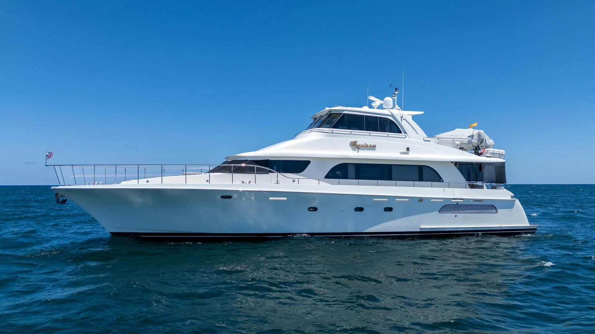 a white yacht in the water aboard EQUINOX X Yacht for Sale
