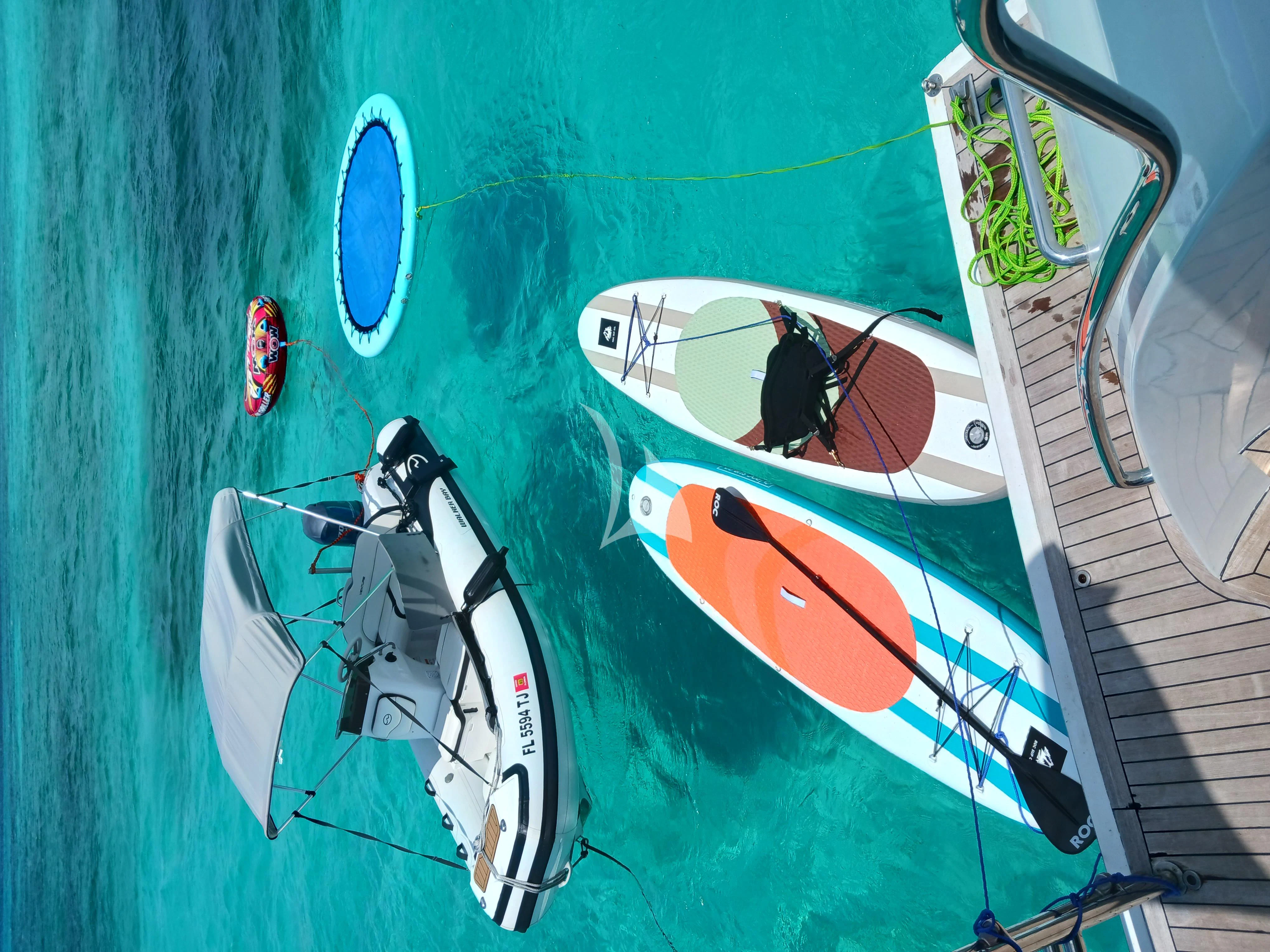 a white boat with a person on it aboard EQUINOX X Yacht for Sale