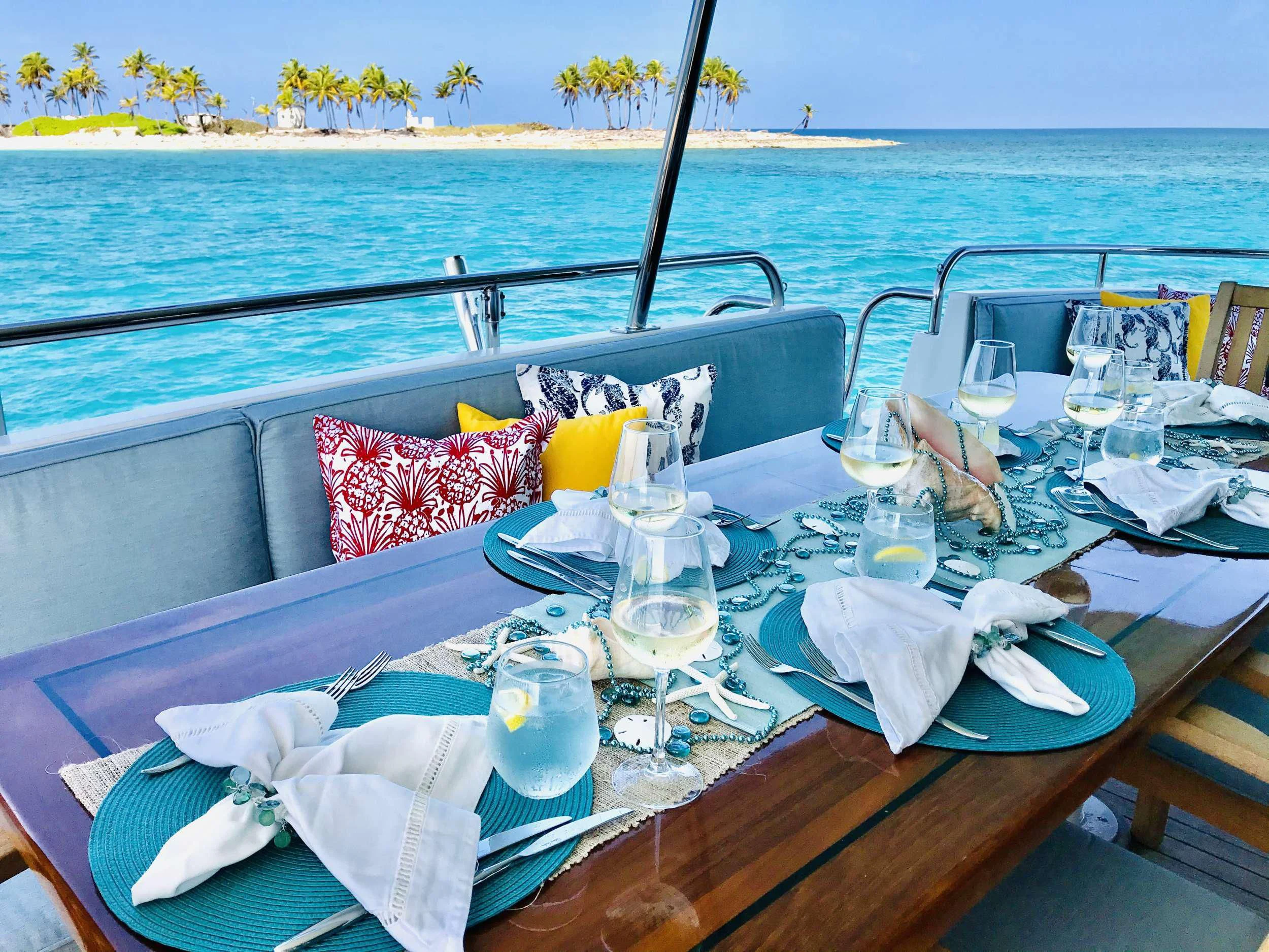 a table with glasses and napkins on it aboard EQUINOX X Yacht for Sale