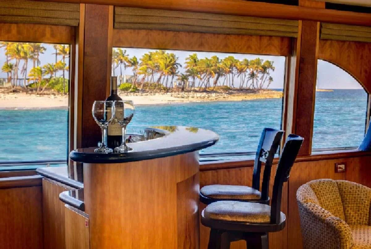 a glass of wine on a table aboard EQUINOX X Yacht for Sale