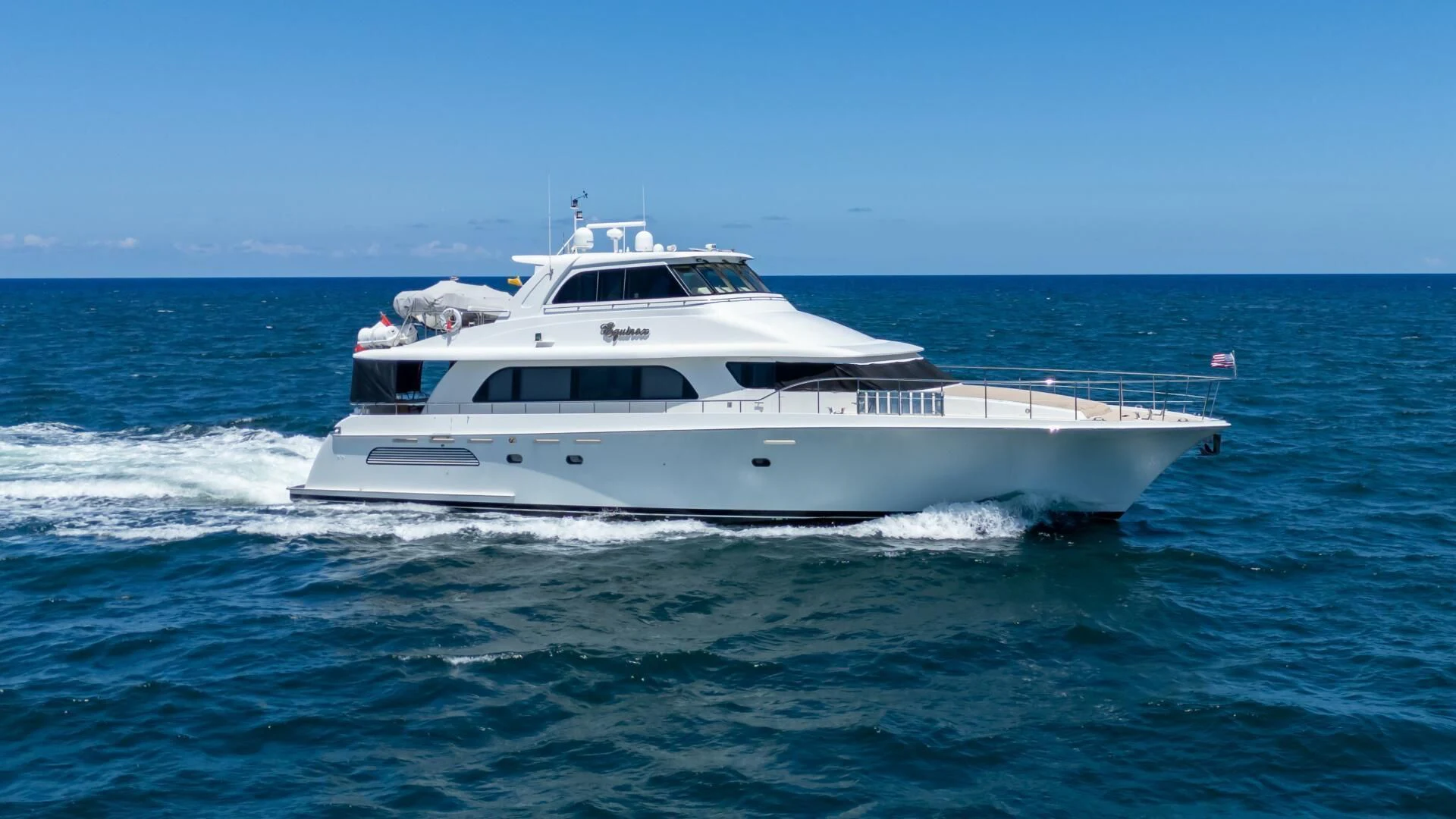 a white boat in the water aboard EQUINOX X Yacht for Sale