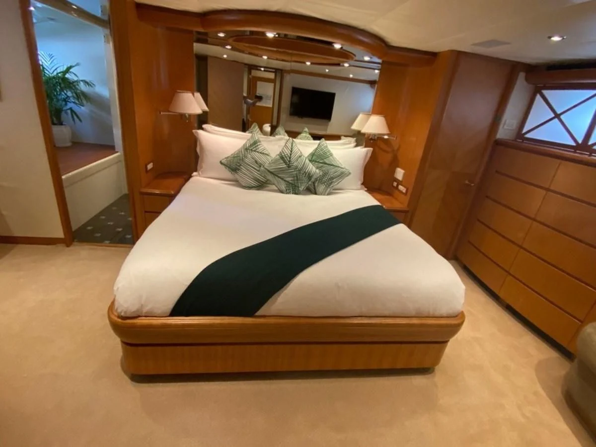 a bed in a room aboard EQUINOX X Yacht for Sale