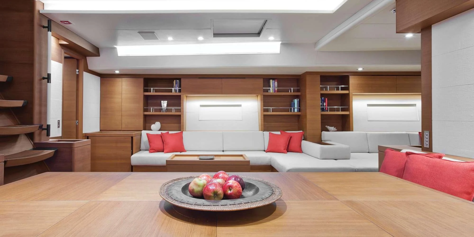 a room with a couch and a table with fruit on it aboard ARAGON Yacht for Sale