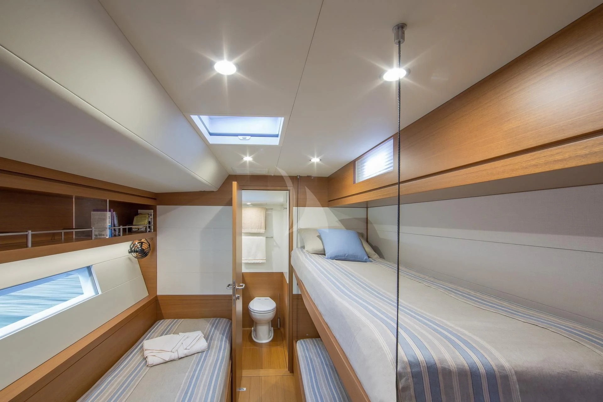 a room with a bed and a window aboard ARAGON Yacht for Sale