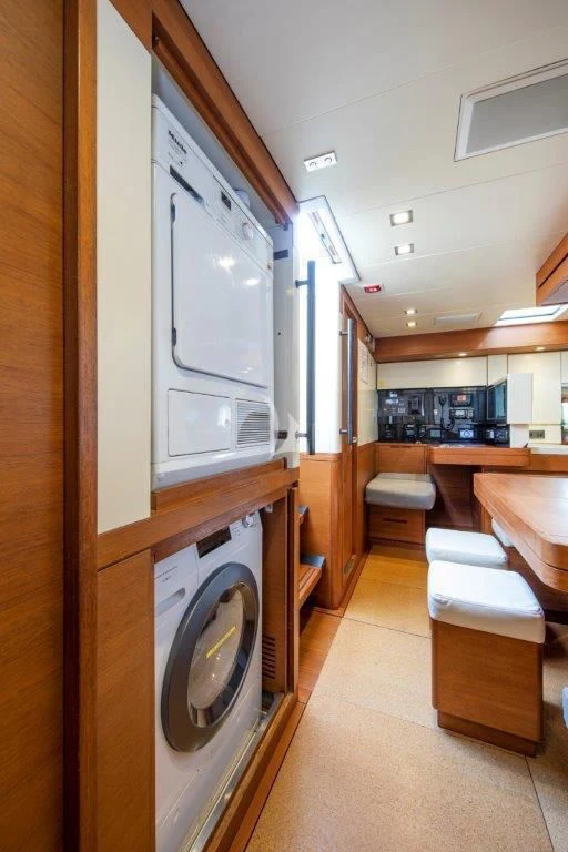 a laundry room with a washing machine aboard ARAGON Yacht for Sale