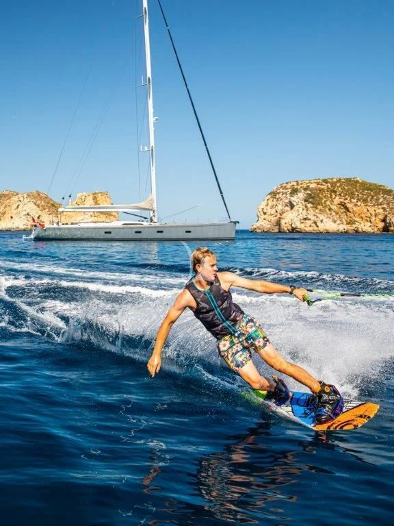a man surfing in the sea aboard ARAGON Yacht for Sale