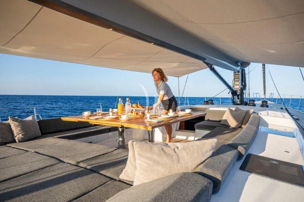 a person standing on a deck of a boat aboard ARAGON Yacht for Sale