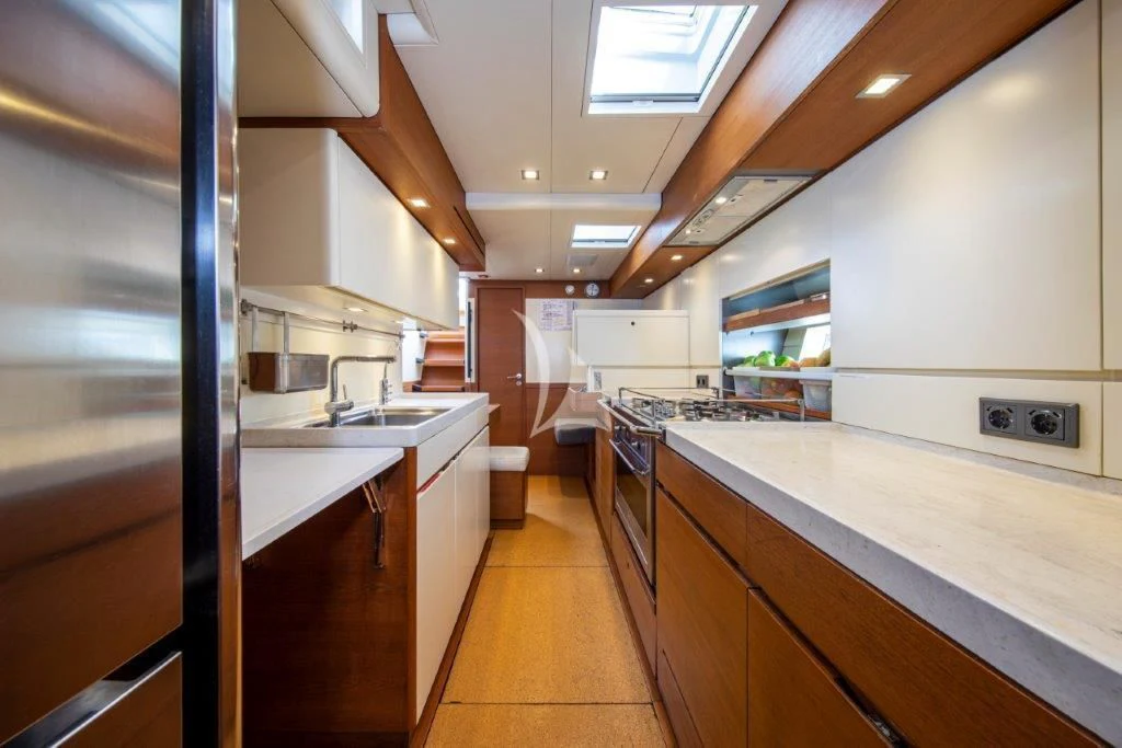 a kitchen with a large refrigerator aboard ARAGON Yacht for Sale