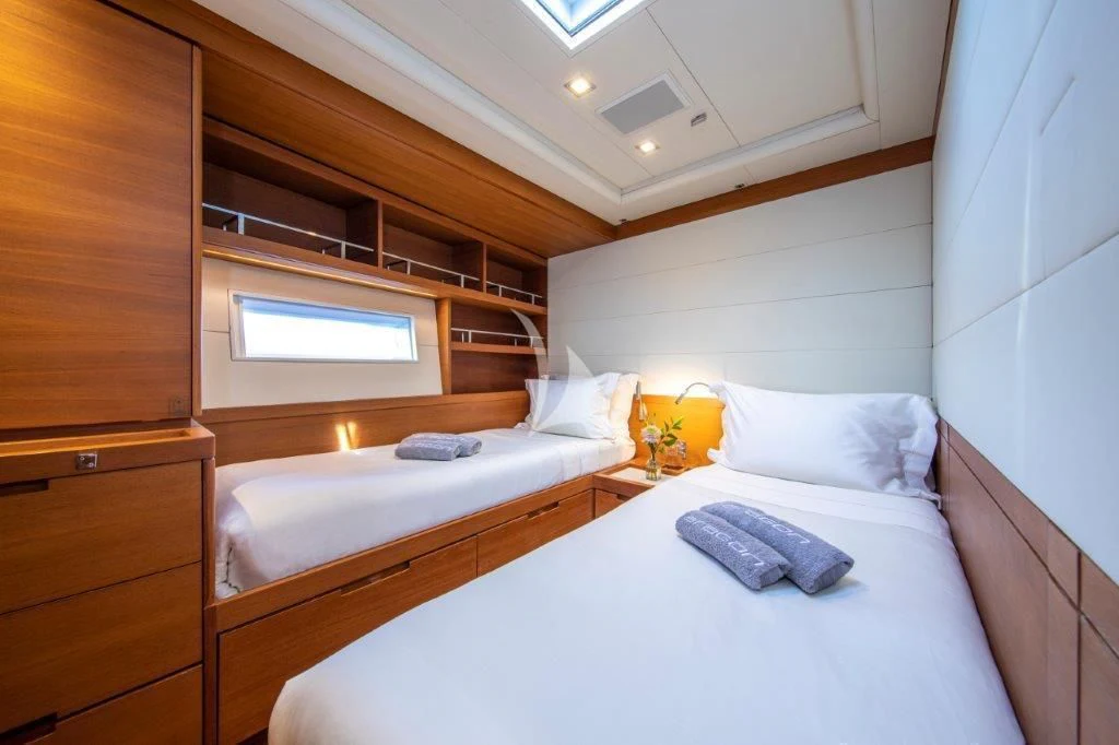 a room with a bed and a window aboard ARAGON Yacht for Sale