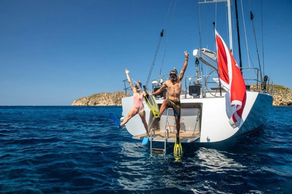 a couple of people on a sailboat aboard ARAGON Yacht for Sale