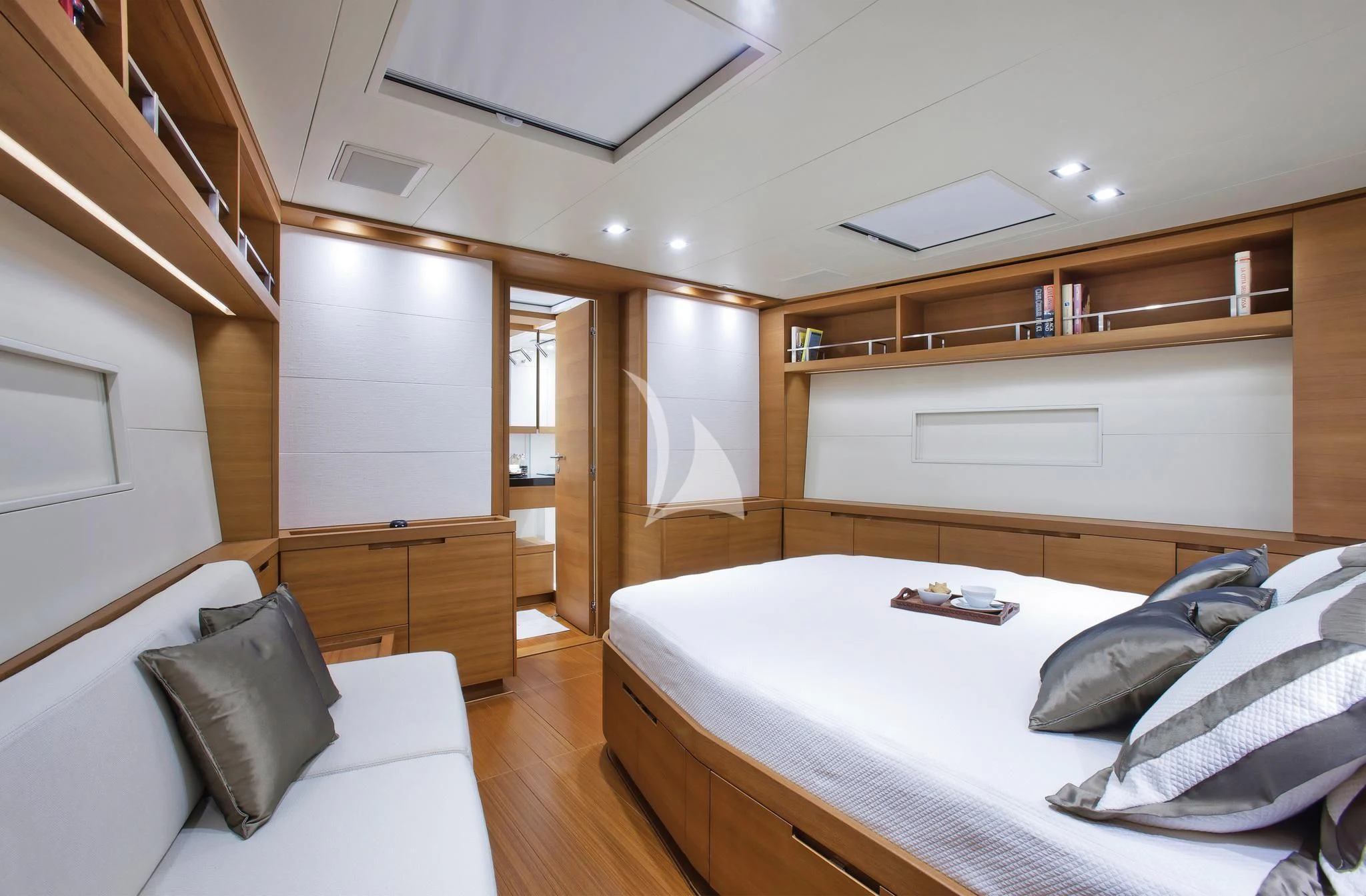 a bedroom with a bed and a desk aboard ARAGON Yacht for Sale