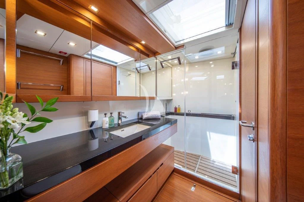 a kitchen with wooden cabinets aboard ARAGON Yacht for Sale