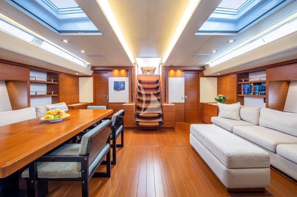 a large living room with a staircase aboard ARAGON Yacht for Sale