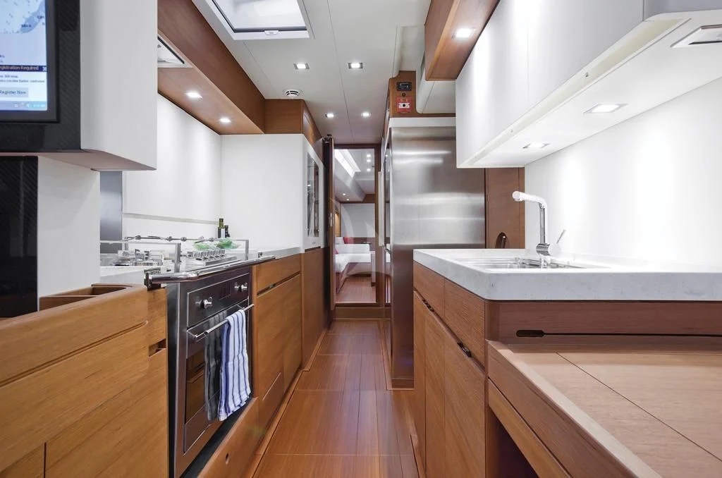 a kitchen with a wood floor aboard ARAGON Yacht for Sale