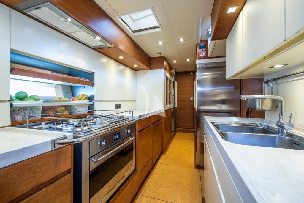 a kitchen with stainless steel appliances aboard ARAGON Yacht for Sale