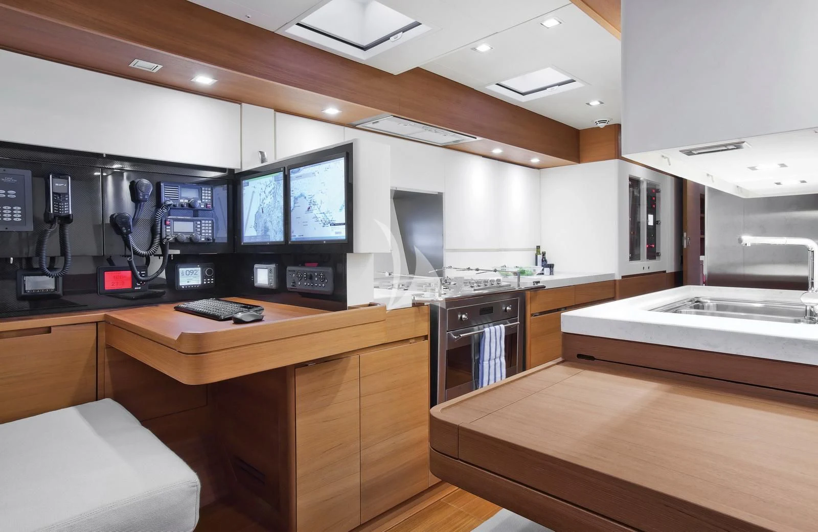 a kitchen with a large island aboard ARAGON Yacht for Sale