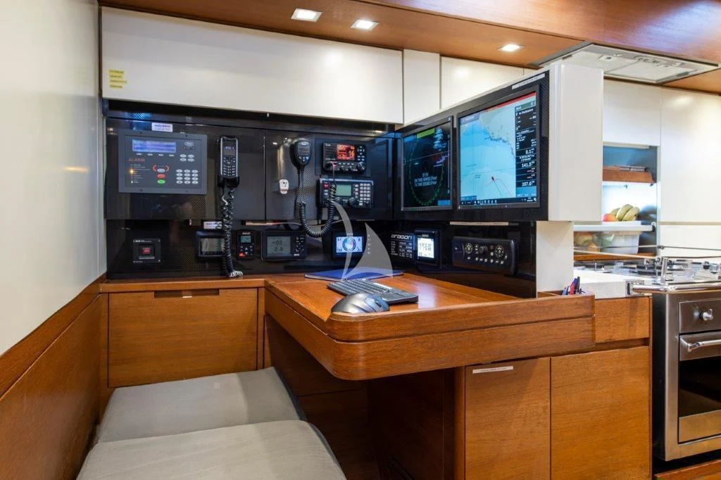 a room with a tv and a couch aboard ARAGON Yacht for Sale