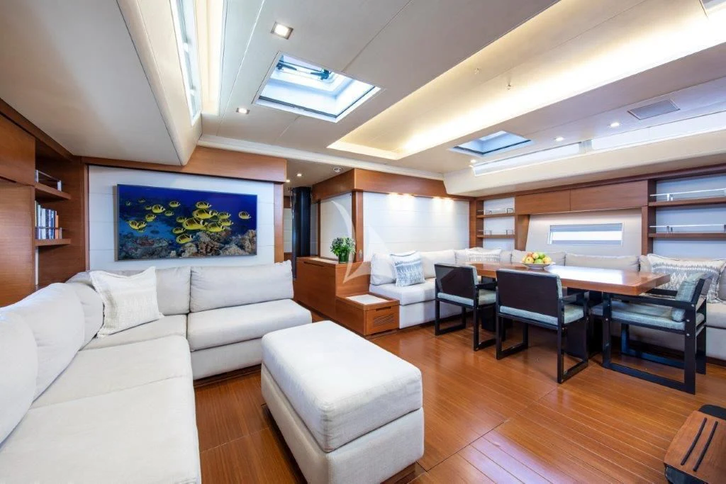 a living room with a couch and a table aboard ARAGON Yacht for Sale