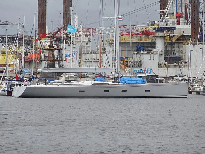 a large white boat in a harbor aboard ARAGON Yacht for Sale