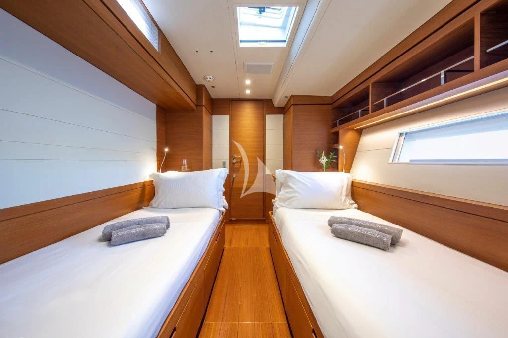 a room with two beds aboard ARAGON Yacht for Sale