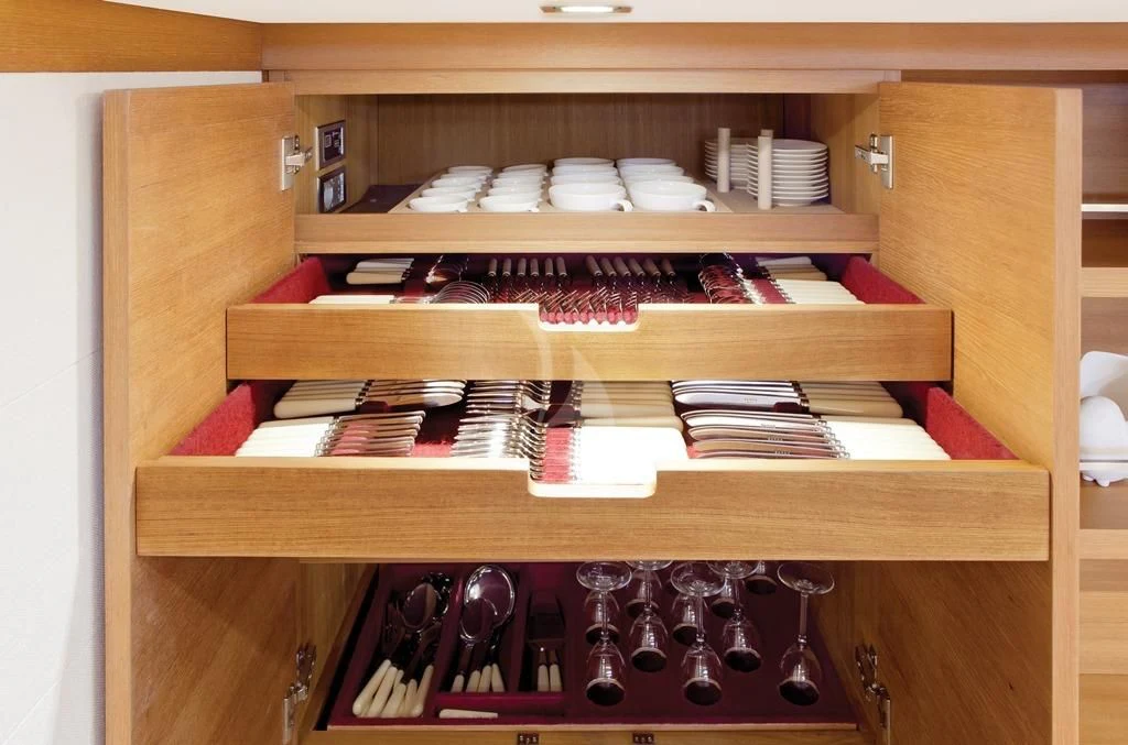 a shelf with bottles and glasses aboard ARAGON Yacht for Sale