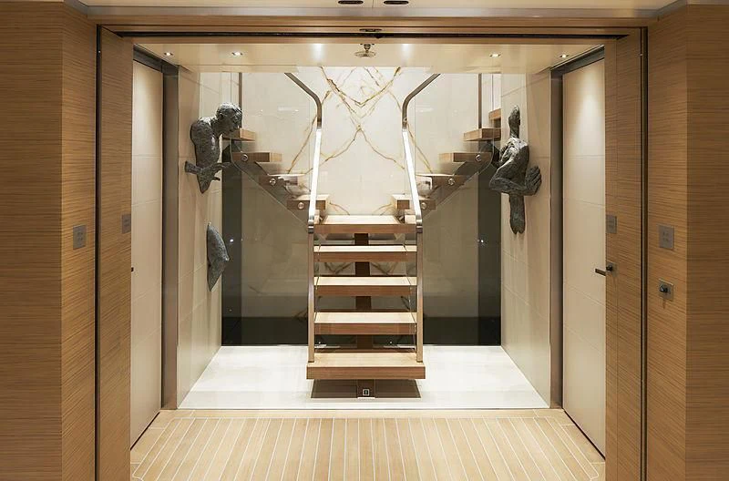 a glass wall with a staircase aboard ATTILA Yacht for Sale